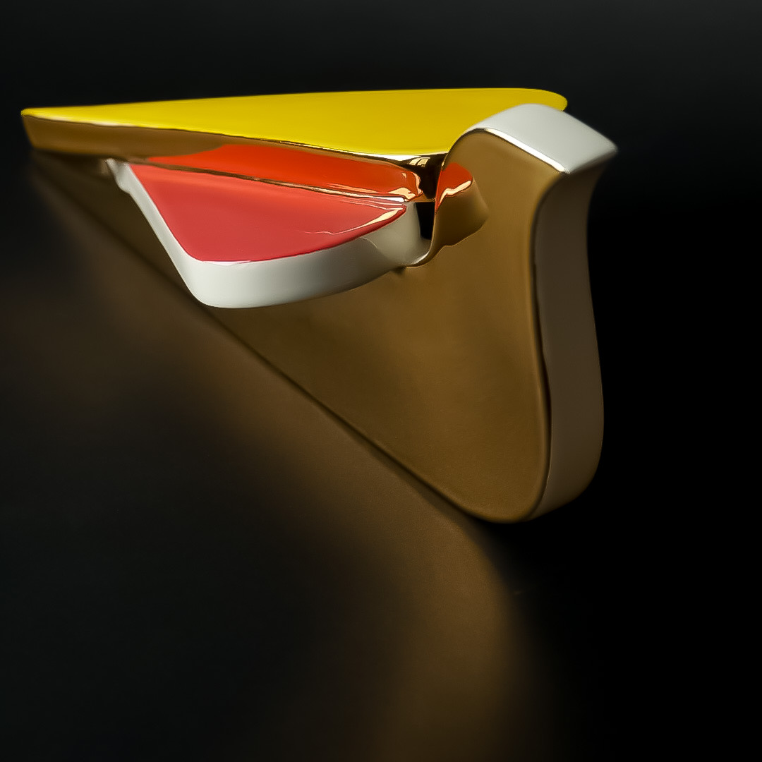 Sculptural orange and gold form study on black
